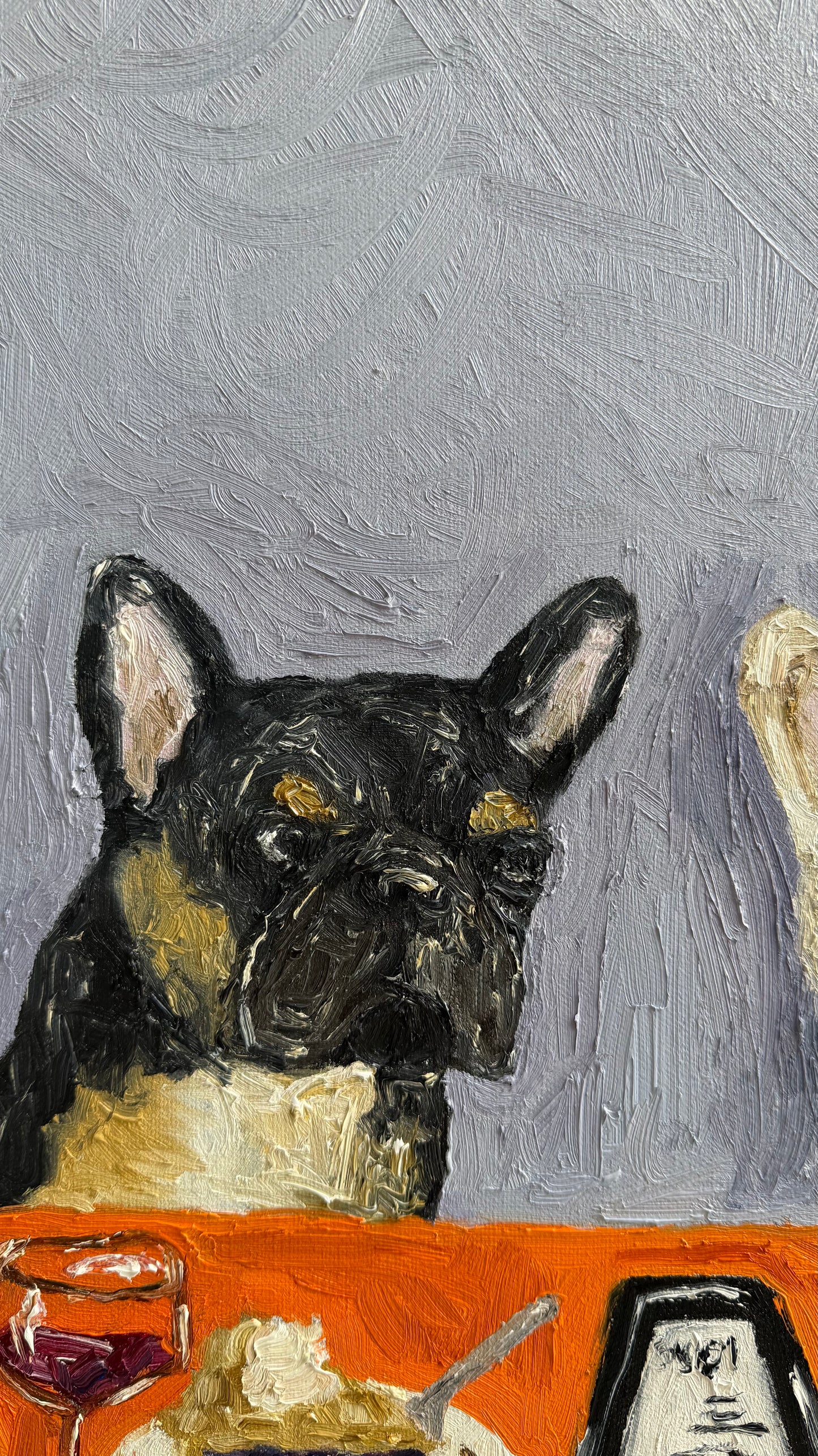 Going Dutch“ by Leah Boyd is a charming 16 x 20 original oil painting featuring a painted black French bulldog seated at a table set with food, a glass of wine, and a receipt against a textured gray background. This signed canvas art adds whimsical elegance to any space.
