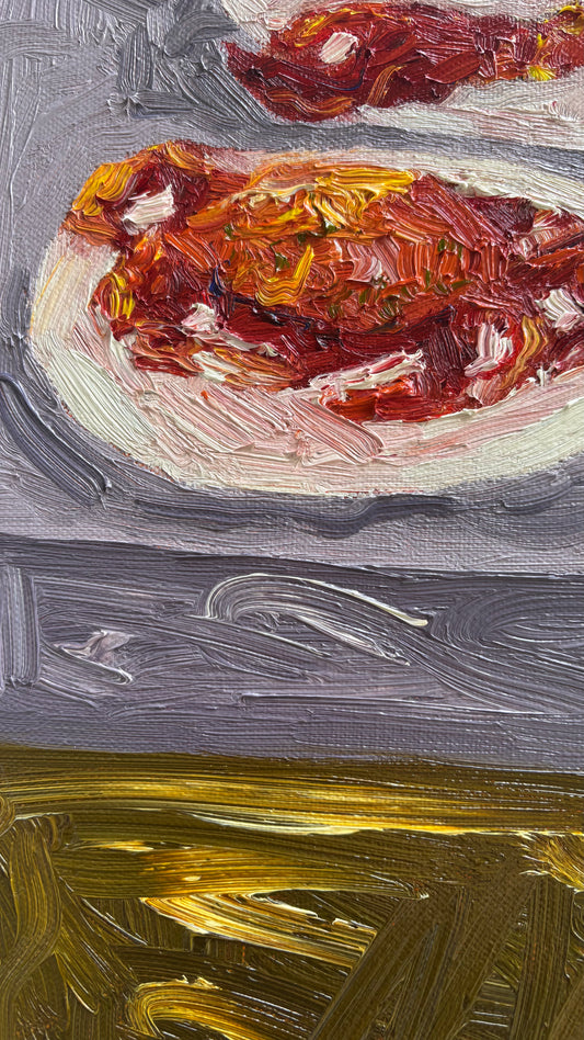 Close-up of "The Kids Table," an original oil painting on canvas by Leah Boyd, featuring a plate with red and white food on a textured gray surface and golden-yellow brushstrokes. Includes certificate of authenticity.
