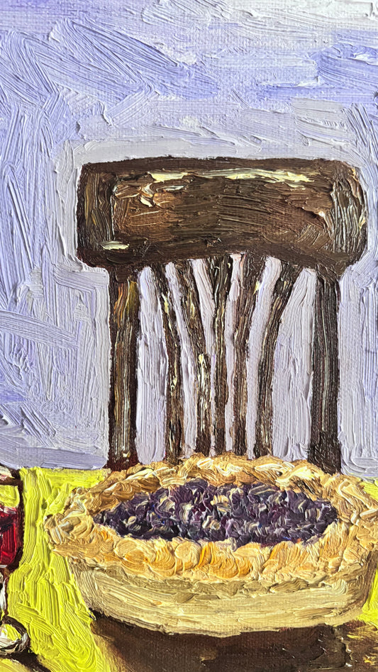 "Summer Twilight" by Leah Boyd is a textured original oil painting featuring a wooden chair, table with blueberry pie, and a glass of red wine on a chartreuse table against a purple backdrop.