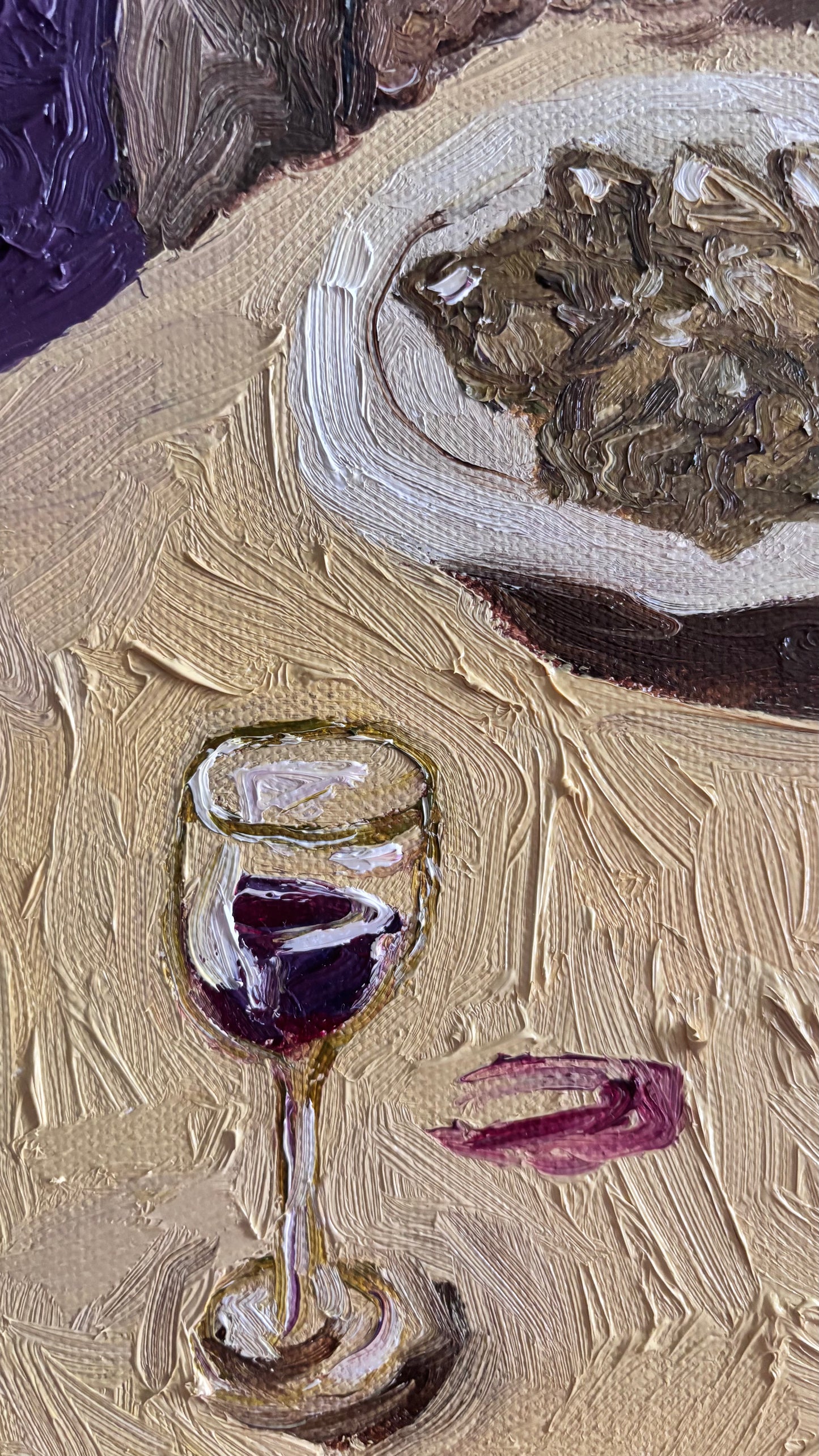 Close-up of Leah Boyd's "Basset Hounds & Artichokes," an original oil painting featuring red wine, food, and artichokes on a textured beige surface. Expressive brushstrokes showcase its painterly style.