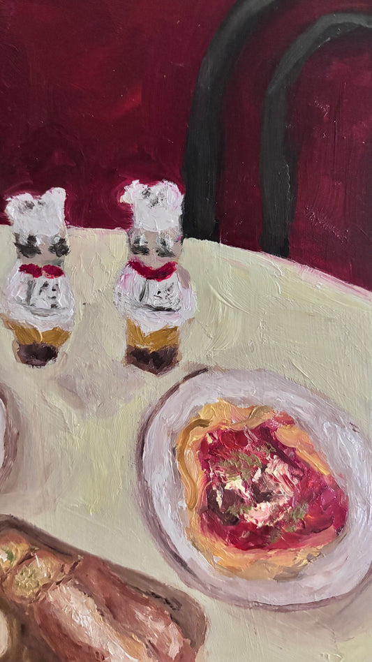 Dinner for One no. 3: Italian by Leah Boyd is an original oil painting on cradled wood panel, featuring chef salt and pepper shakers, pasta in red sauce, and bread on a table against a rich red backdrop with a black chair.