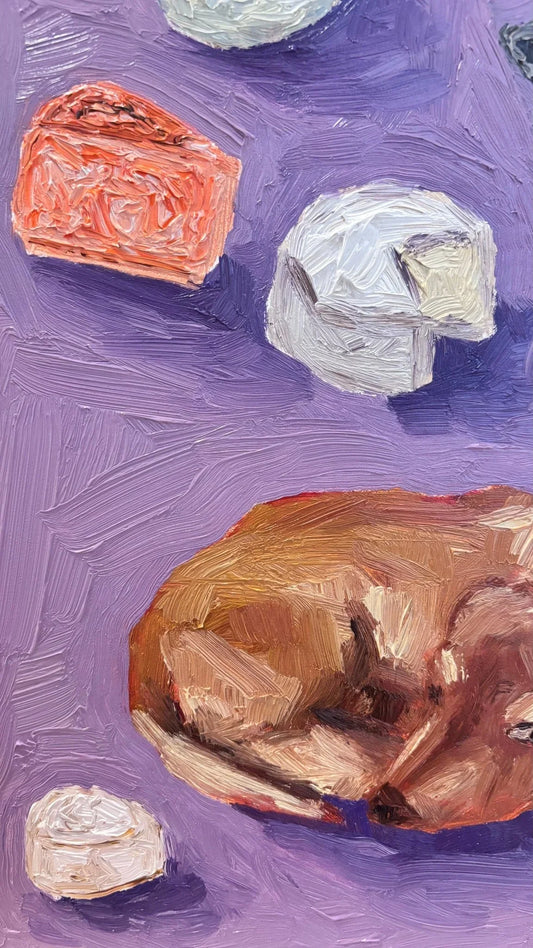 Dachshunds and Cheese" by Leah Boyd is an original oil painting on gesso-board, showcasing vivid, textured brushstrokes of orange and whites cheeses in round and wedge shapes on a purple surface.