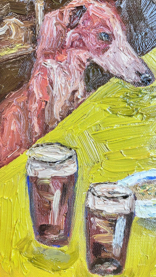 Leah Boyd's "Dinner for One no. 12: Crab Legs" is an original canvas oil painting of a pinkish-brown dog with a long snout resting on a yellow table, beside two pints of dark beer and food, rendered in bold, textured brushstrokes.