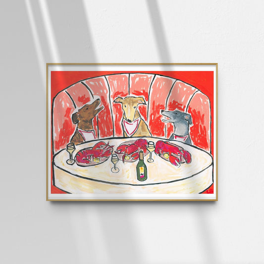 The "Lobsters & Yap" limited edition art print by Leah Boyd features three dogs in bibs at a round table with lobsters and wine, set against a red booth, sunlight casting shadows around the frame.