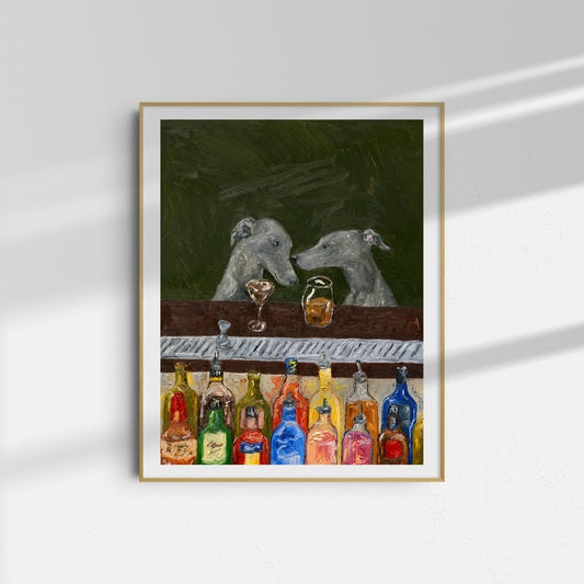 Bar Scene [PRINT PREORDER] by Leah Boyd is a framed oil-on-canvas reproduction depicting two gray dogs sitting across from each other at a bar, with an array of colorful bottles displayed on the counter before them. The background features a rich dark green hue, and soft lighting creates gentle shadows on the wall.