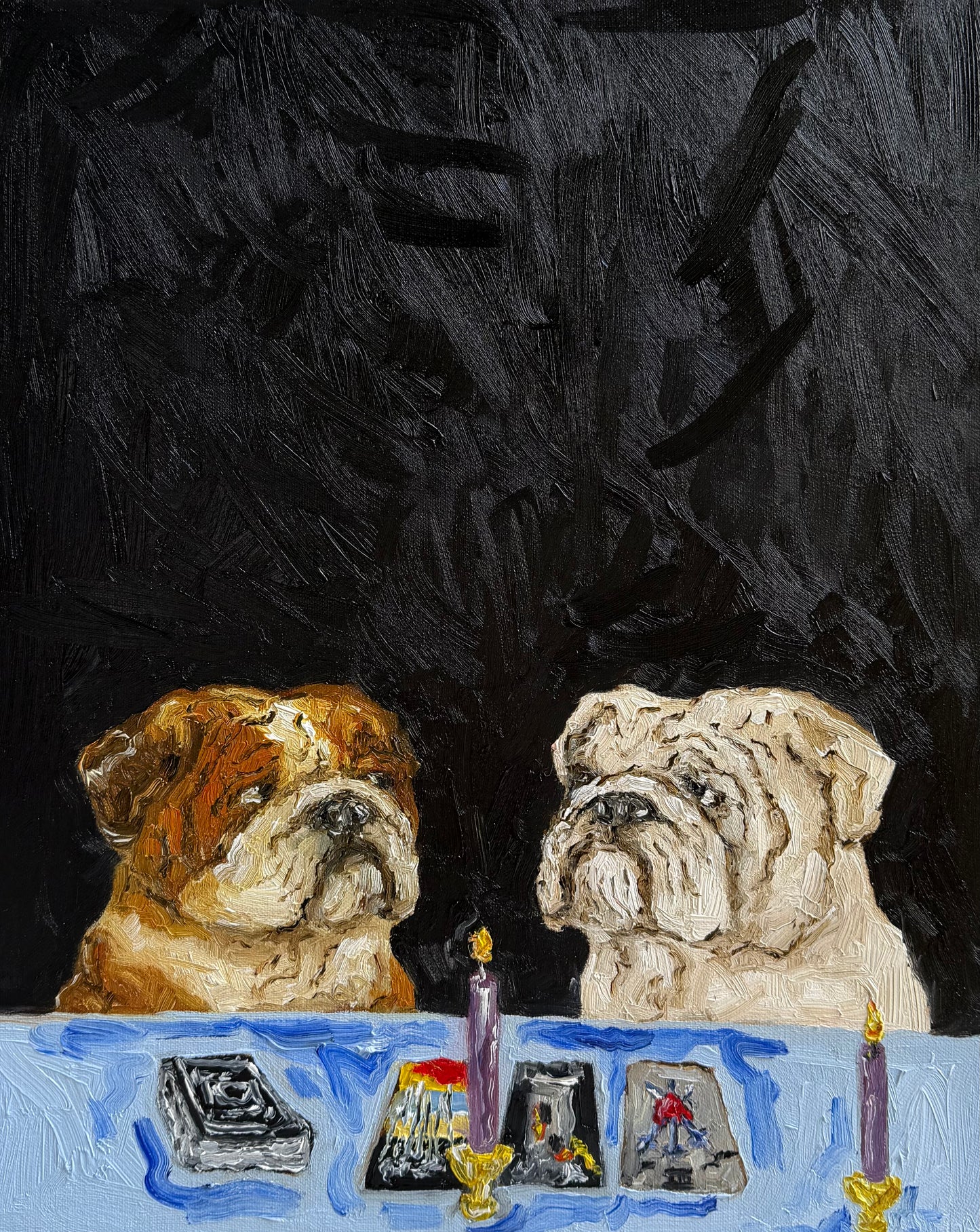 In “A Ruff Reading” by Leah Boyd, two bulldogs sit at a table with tarot cards and two lit candles, set against a dark textured background. This original oil painting features a loose, expressive style and arrives ready to hang, complete with a certificate of authenticity.