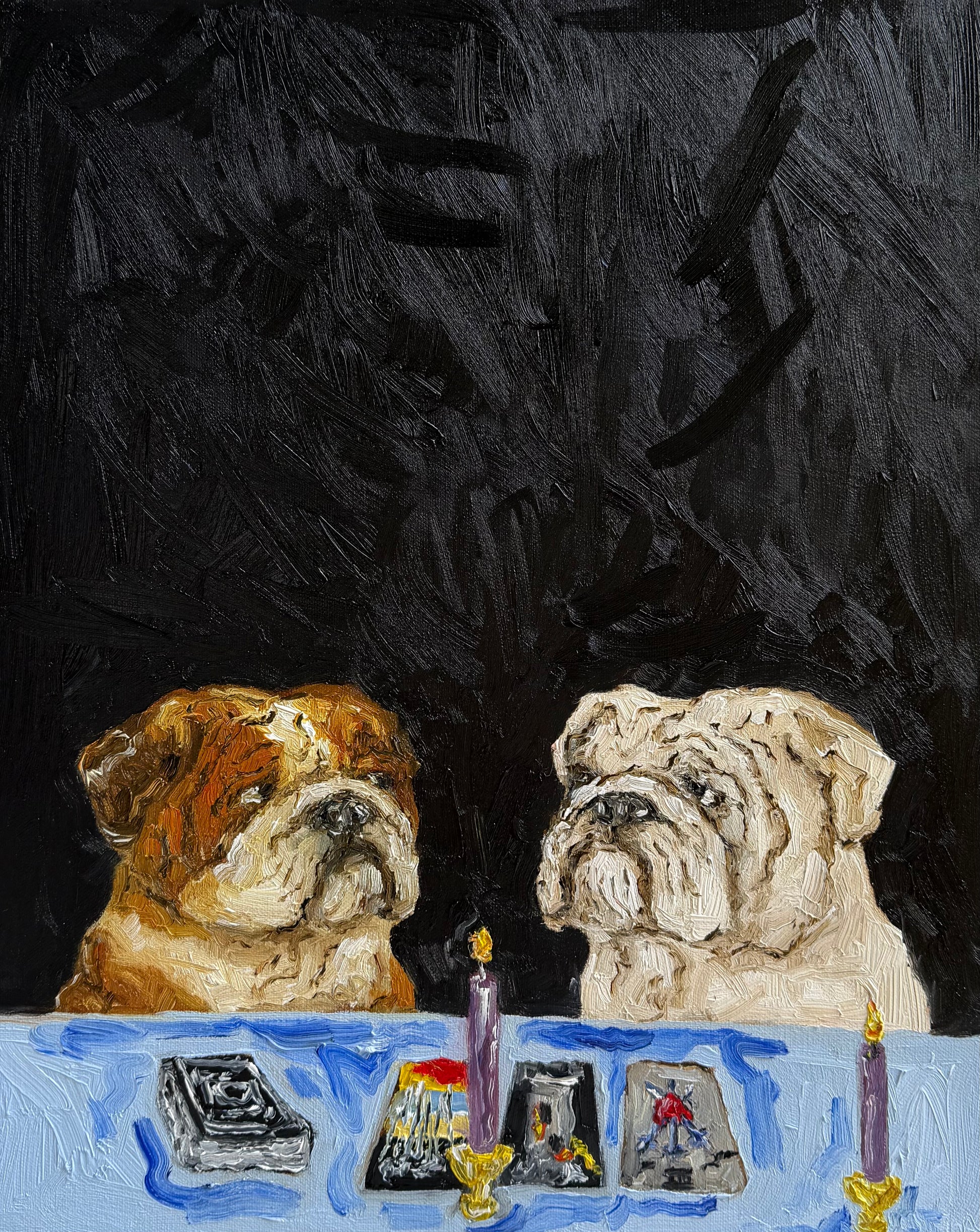 In “A Ruff Reading” by Leah Boyd, two bulldogs sit at a table with tarot cards and two lit candles, set against a dark textured background. This original oil painting features a loose, expressive style and arrives ready to hang, complete with a certificate of authenticity.
