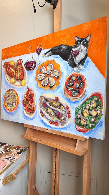 Feast of the Seven Fishes" by Leah Boyd is a vibrant oil painting featuring a black and white cat lounging on a table with seafood, meats, and wine, set against an orange and blue backdrop—an original artwork.