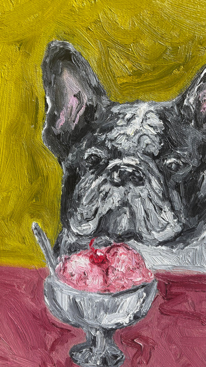 À la mode by Leah Boyd is an original oil painting featuring a black and white French Bulldog gazing at a silver dish of pink ice cream with a spoon, set against a vibrant yellow background and red table. This charming canvas art makes the perfect addition to any dog lover’s collection.