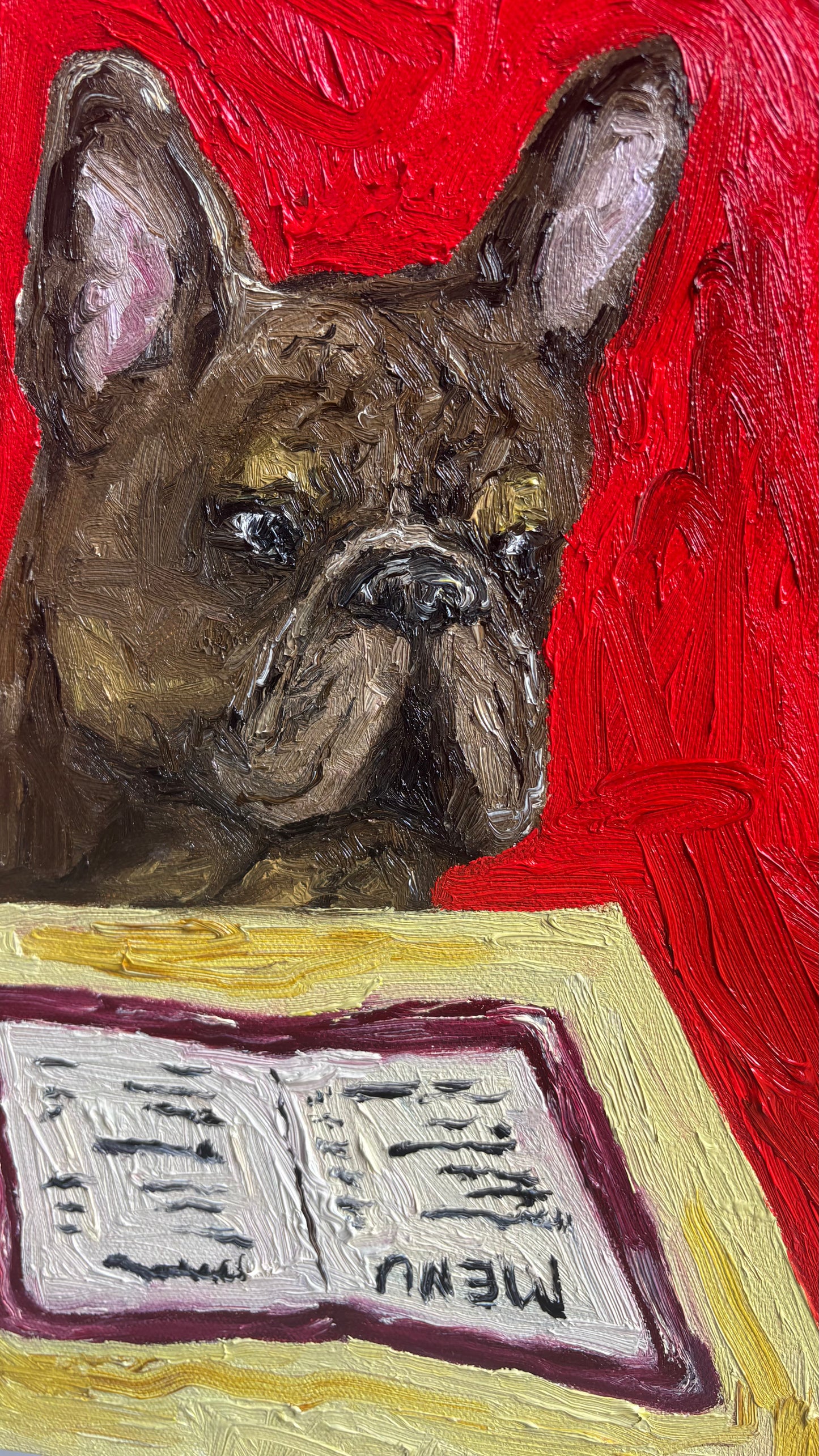 “I’ll Have What She’s Having” by Leah Boyd is an original oil painting featuring a brown French Bulldog gazing at a menu on a table, set against a vibrant red background. This charming artwork comes ready to hang and includes a certificate of authenticity.