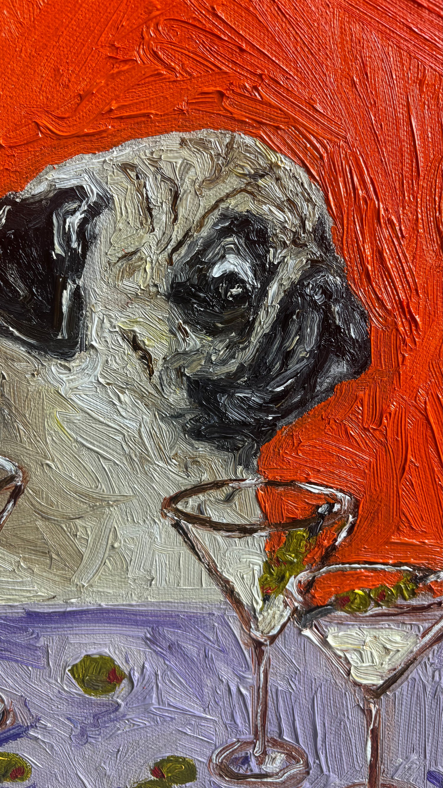 Introducing “One Too Many” by Leah Boyd—an original oil painting featuring a pug’s head set against a richly textured red background, alongside three martini glasses with olives on a purple surface. This whimsical and vibrant canvas art is perfect for adding character and charm to any space.