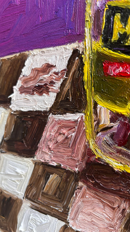 Close-up of a signed original oil on canvas by Leah Boyd shows textured brushstrokes of a checkered brown and white table and purple background  with Mt. Olive Pickles and collard greens.