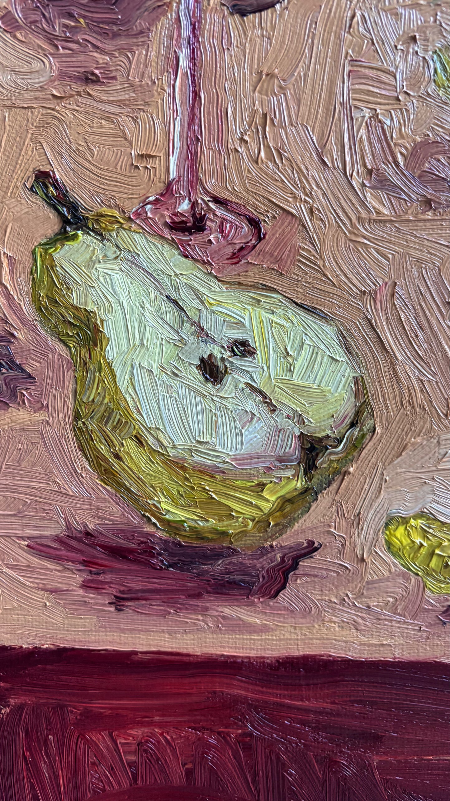 "Pears & Pepperoncini" by Leah Boyd is an original impressionist oil painting featuring a green pear and partial wine glass on a pink table, with textured brushstrokes highlighting the beauty of pears and pepperoncini.