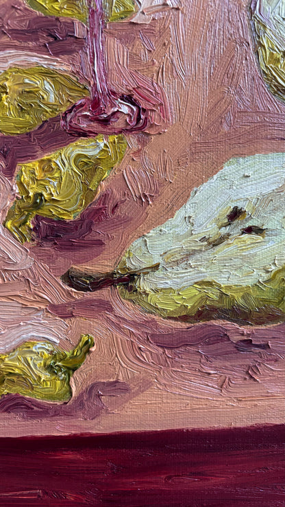 Close-up of "Pears & Pepperoncini" by Leah Boyd, a signed oil painting with textured brushstrokes, featuring a light green pear, pepperoncini, and a reddish-pink background.