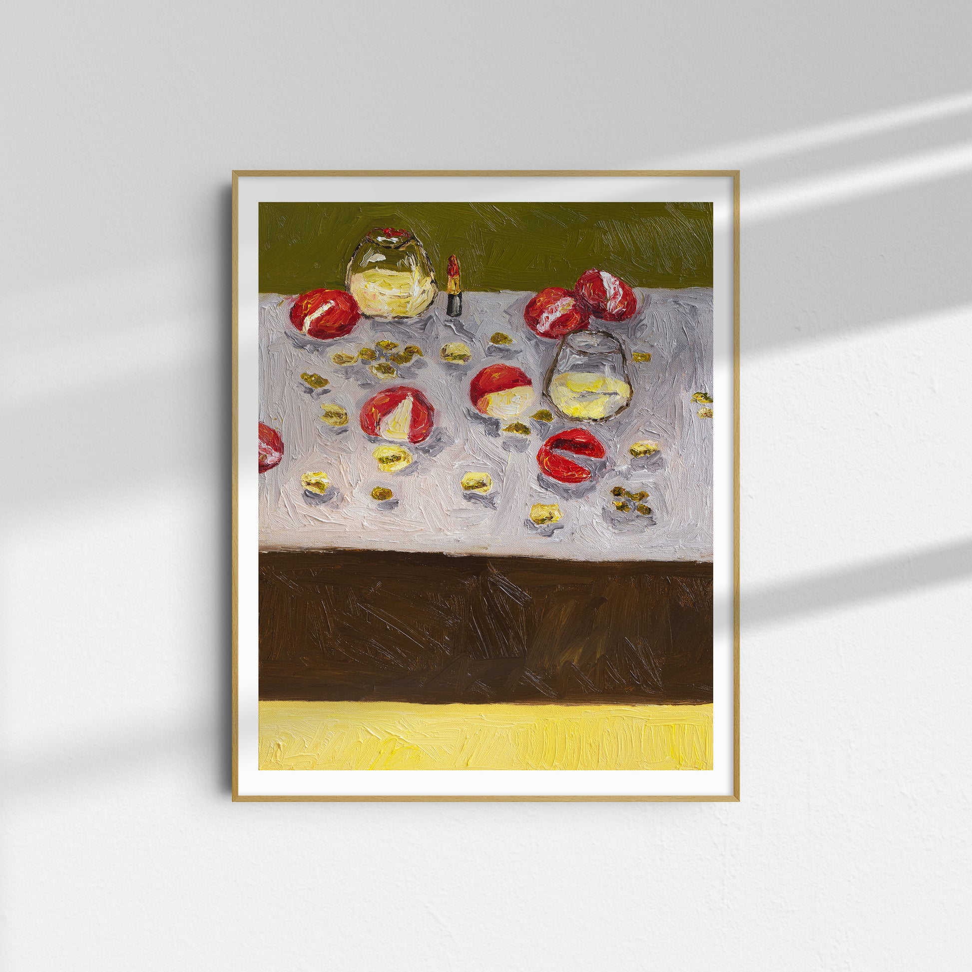 Memories of My Mother" by Leah Boyd is a limited edition framed Giclee print featuring red and yellow fruits on a textured surface in impressionist style, displayed on a white wall with sunlight casting soft shadows.