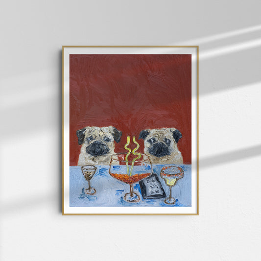 Framed oil on canvas painting titled “Who’s Driving?” by Leah Boyd, featuring two pugs sitting at a table with drinks, a dessert, and a menu that reads DOG, set against a textured red background. The artwork hangs on a white wall with sunlight casting shadows.