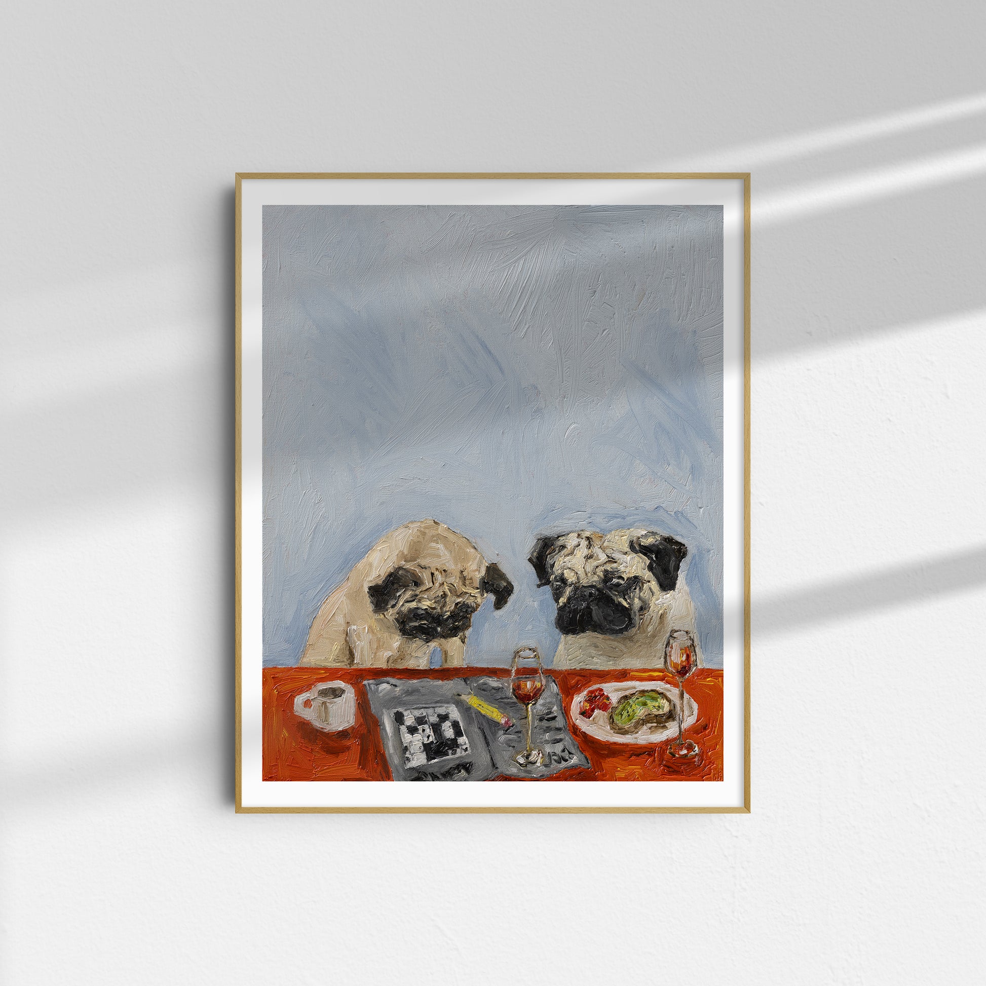 Morning Conundrum B-Grade Print" by Leah Boyd is an 11x14 framed artwork of two pugs at a red table with food, set against a blue-gray background, printed on premium cotton rag.