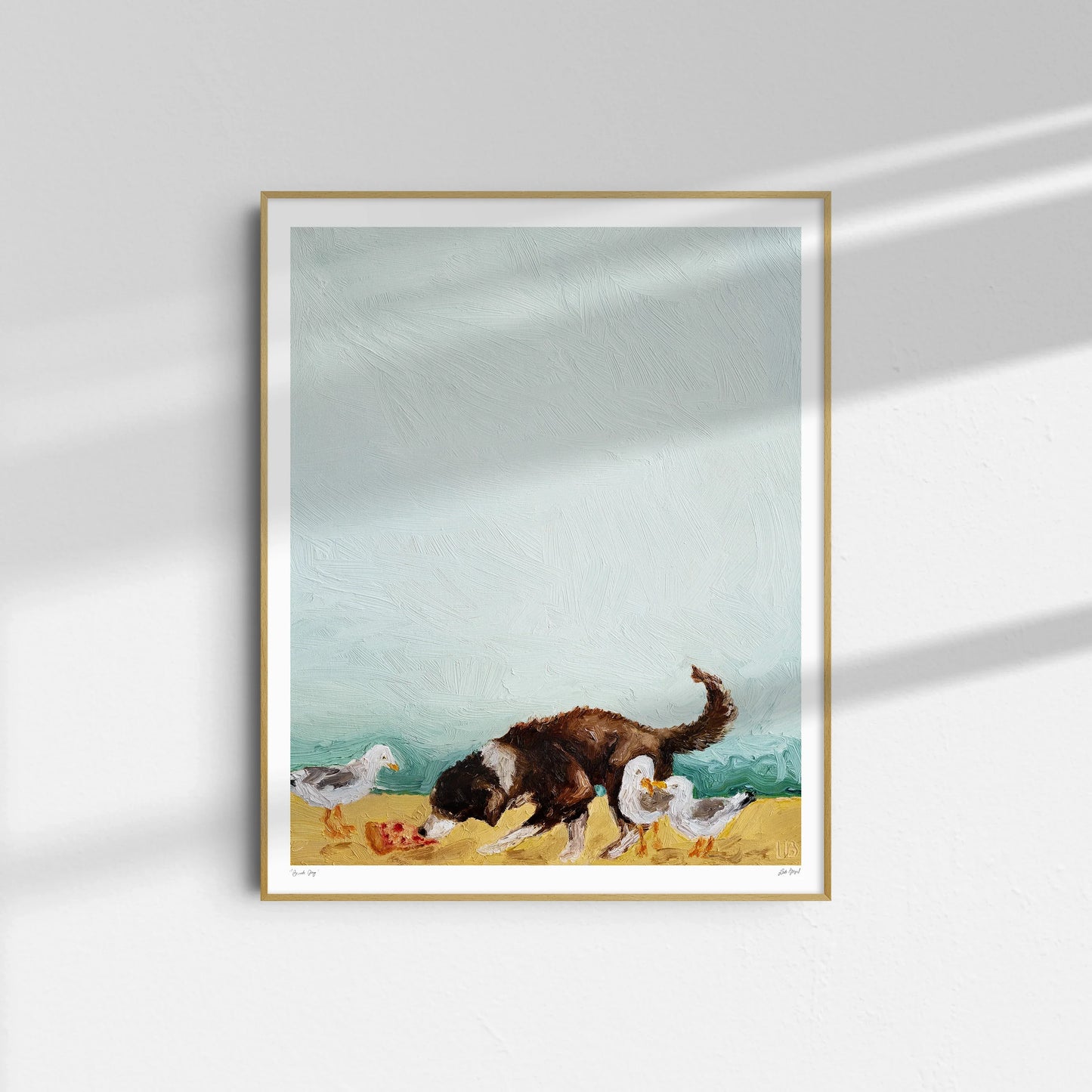 Beach Day" by Leah Boyd is a framed oil on canvas featuring a dark brown and white dog sniffing the ground beside three white birds, displayed against a light wall with gentle shadows.