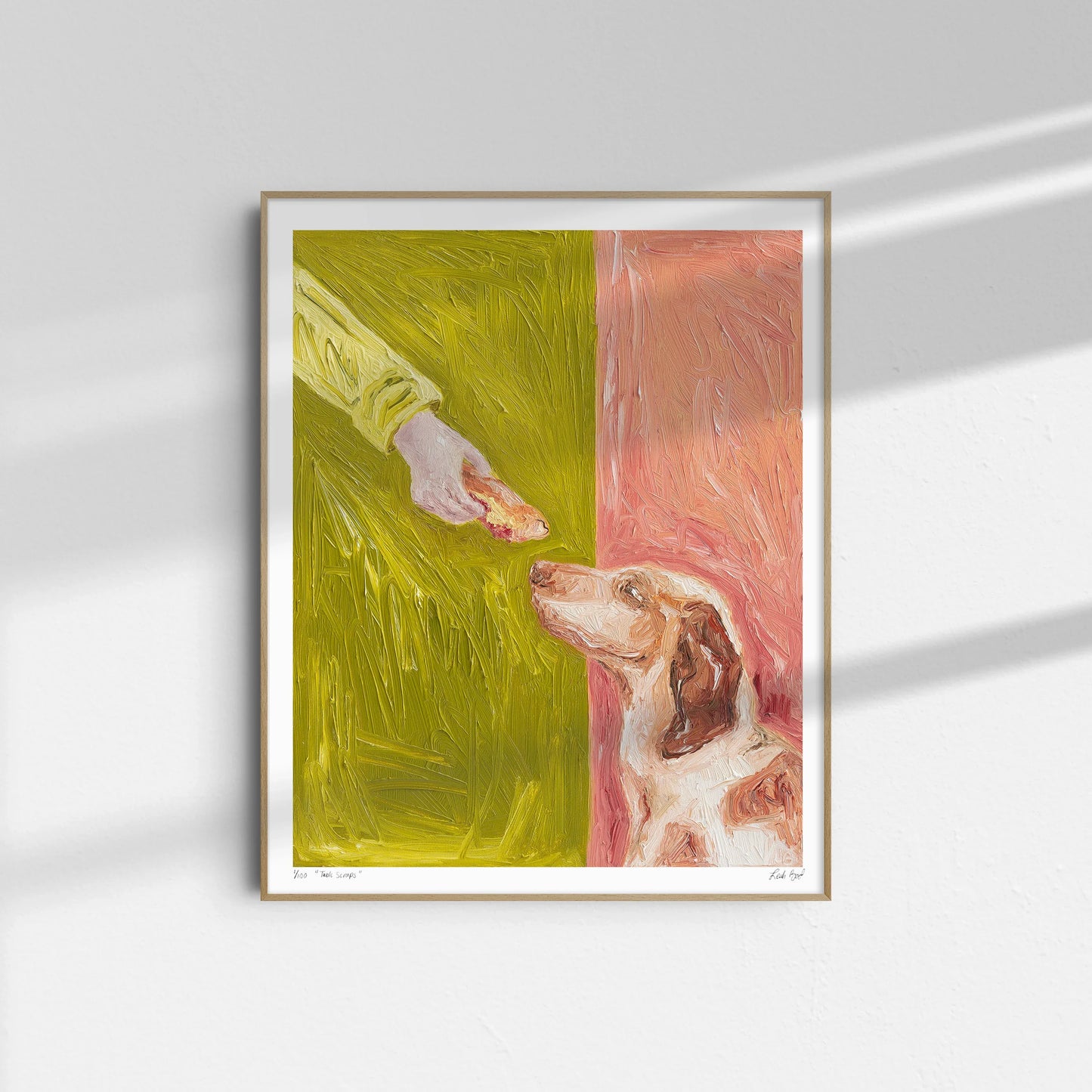 "Table Scraps" by Leah Boyd is a framed painting showing a dog gazing up at a hand offering a treat, set against expressive green and pink backgrounds with textured brushstrokes.