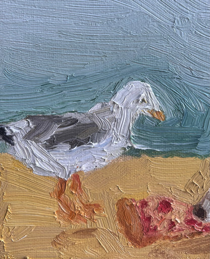 "Beach Day" by Leah Boyd is an original oil painting of a seagull on sand eating pizza. Thick brushstrokes give rich texture to the subjects, sand, and sky. This signed artwork is ideal for fans of coastal scenes.