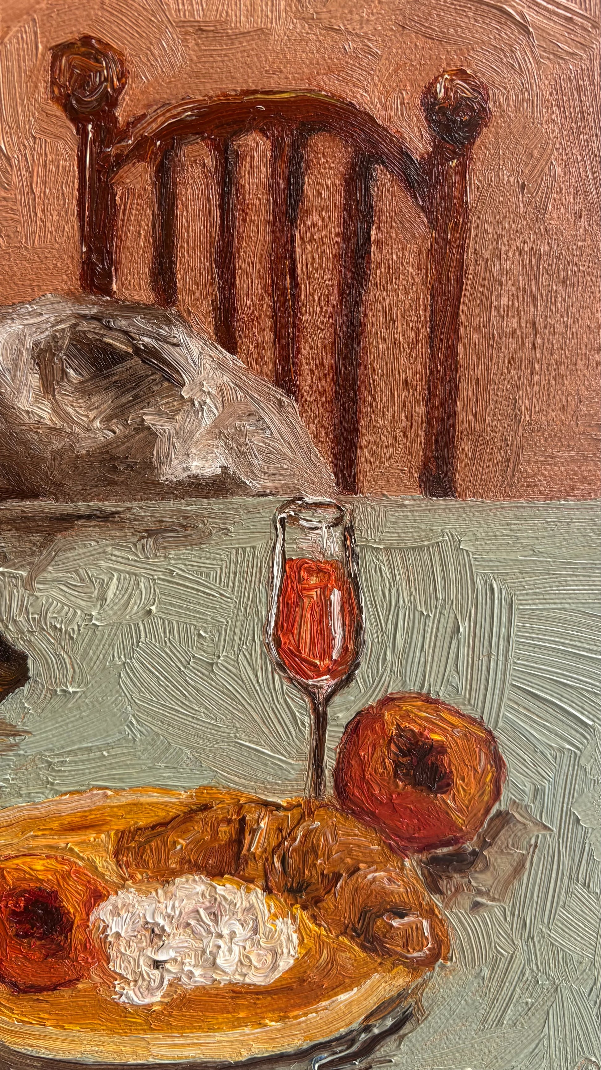Leah Boyd’s “Sunny Mornings” is a textured original oil painting on canvas depicting a wooden chair, food on a plate, red drink in a glass, and two fruits on a table, all rendered with expressive brushstrokes.